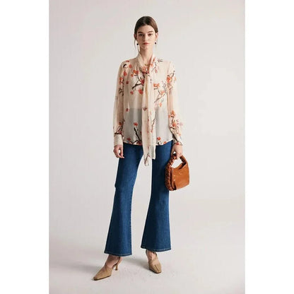 Elegant floral pattern silk and viscose blend blouse with bow collar and puff sleeves