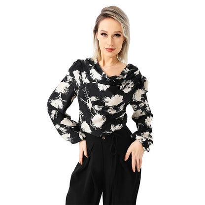 Elegant ladies' blouse with a printed pattern, dropped collar, and long sleeves in a classic white colour