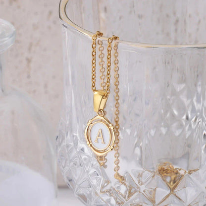 Elegant gold-tone letter pendant necklace with innovative drip oil design and integrated fitness tracker