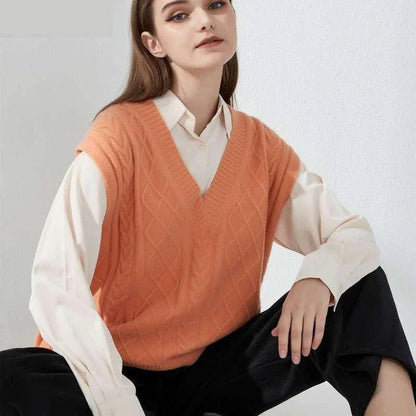 Cosy oversized knitted vest in various colours, featuring a sleeveless V-neck design for versatile layering