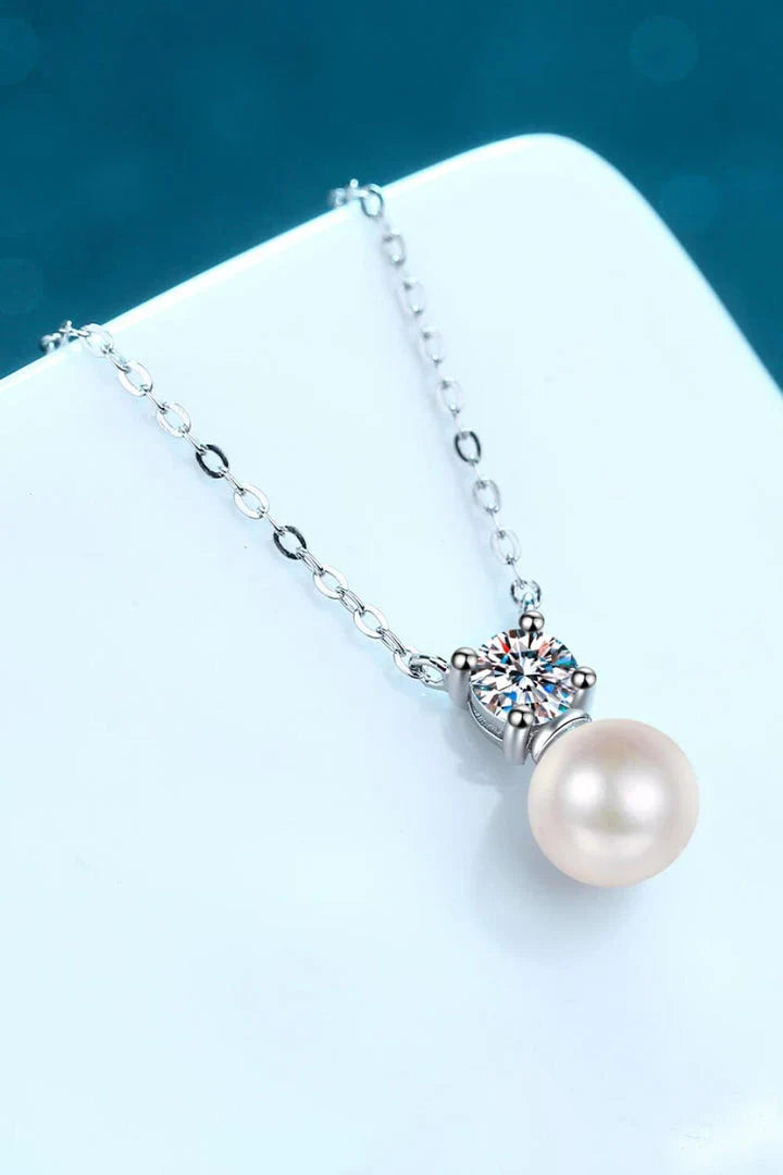 925 sterling silver necklace featuring freshwater pearls and a moissanite centre stone, a stunning piece of British-inspired jewellery