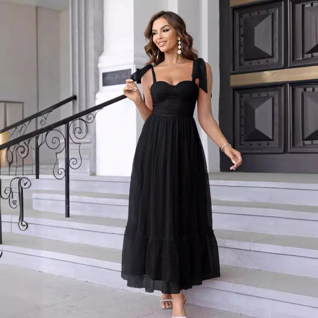 Enchanting fairy-style dress with flowing silhouette, delicate lace accents, and mid-length skirt in a classic black colour
