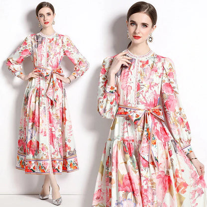 Elegant floral single-breasted swing dress with delicate print, tailored design, and flowing silhouette