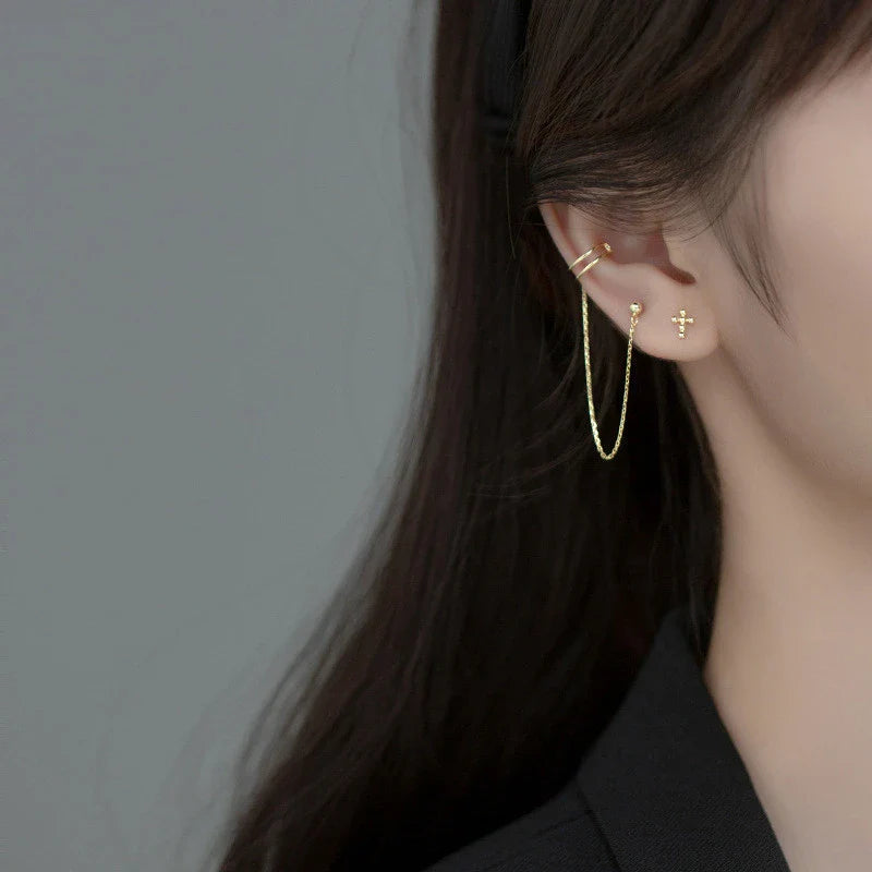 Asymmetric sterling silver one-piece earring and ear clip set with a modern and distinctive design