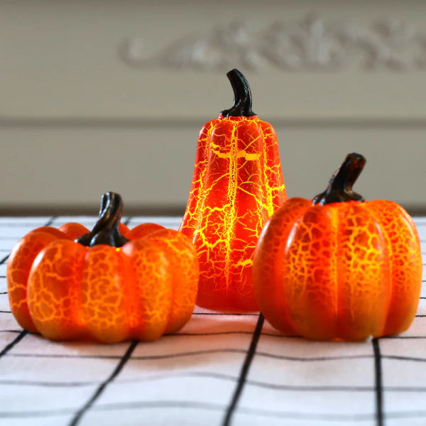 Captivating pumpkin-shaped LED lamps crafted with premium resin, creating a warm and inviting ambiance