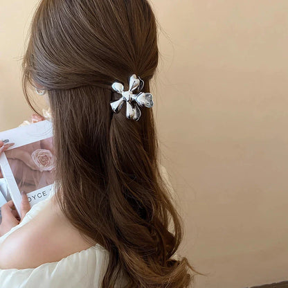 Gold floral metal hair claws - chic hair accessories for women with modern design and natural elegance