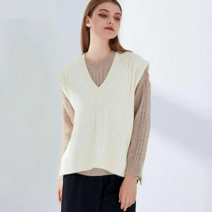 Cosy oversized knitted vest in various colours, featuring a sleeveless V-neck design for versatile layering