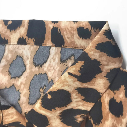 Elegant leopard print beach cover-up dress with A-line silhouette, loose waist, and pockets for comfortable and stylish holiday wear
