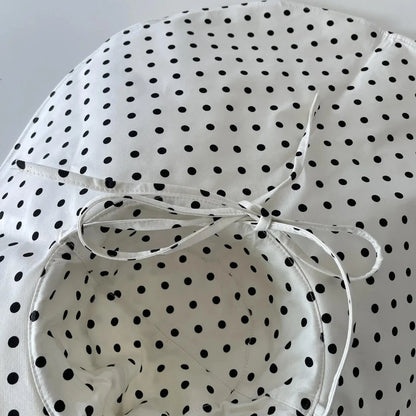 Elegant oversized polka dot sun hat for stylish UK women, offering excellent sun protection and a classic, fashionable design.