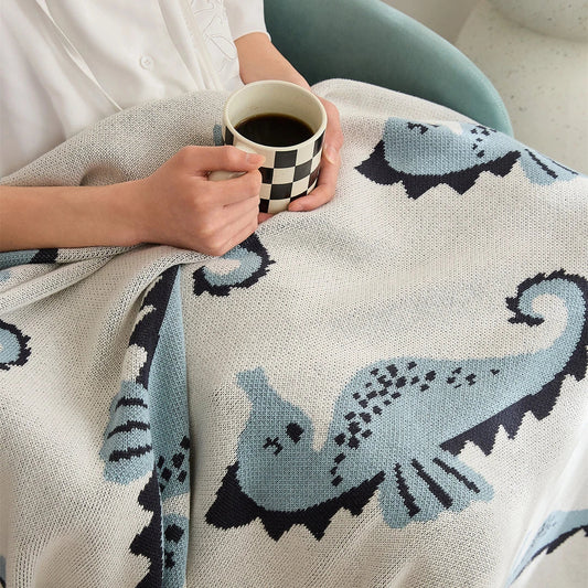 Cosy Sea Horse Cotton Throw Blanket in pink and lake blue colours, featuring a playful sea horse pattern and jacquard weave design.