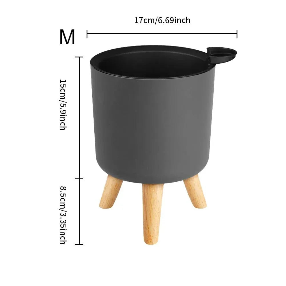Modern self-watering planter with sleek wooden stand, available in small, medium, and large sizes