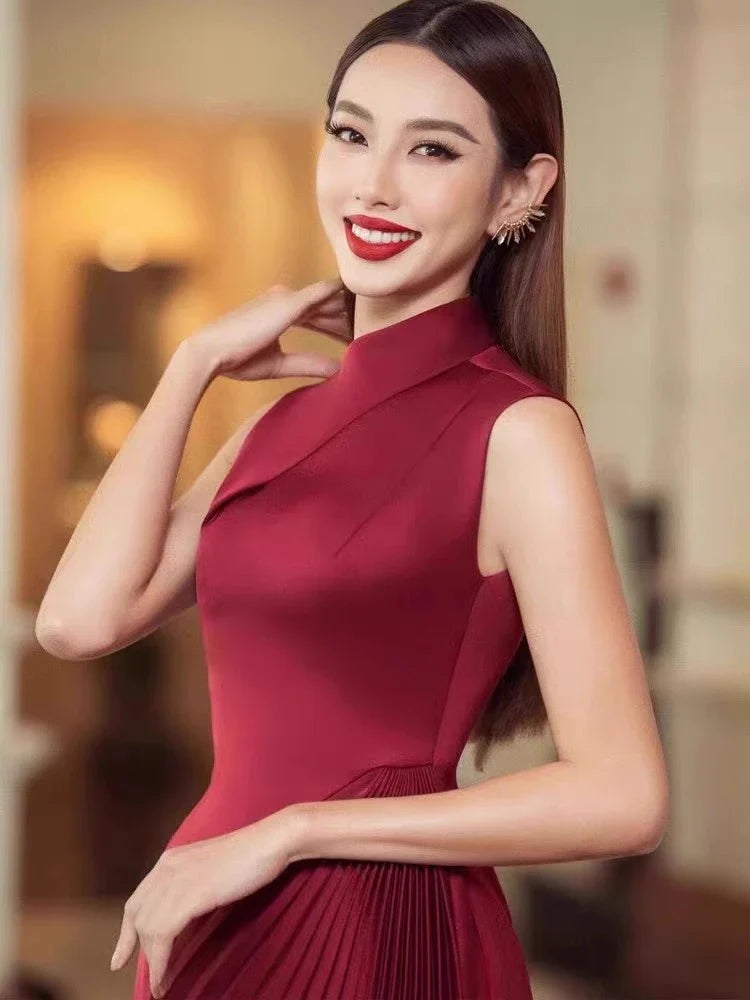 Elegant asymmetric dress in wine red and milky white with a half turtleneck design, perfect for autumn and winter wear.
