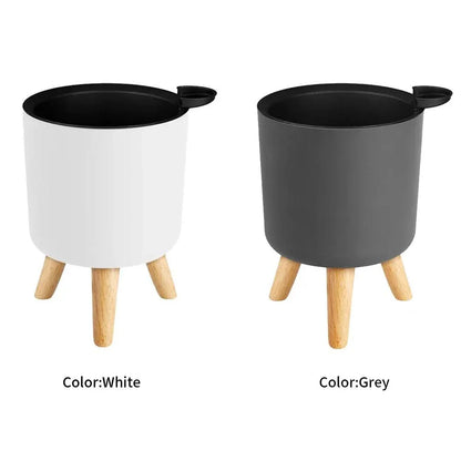 Modern self-watering planter with sleek wooden stand, available in small, medium, and large sizes