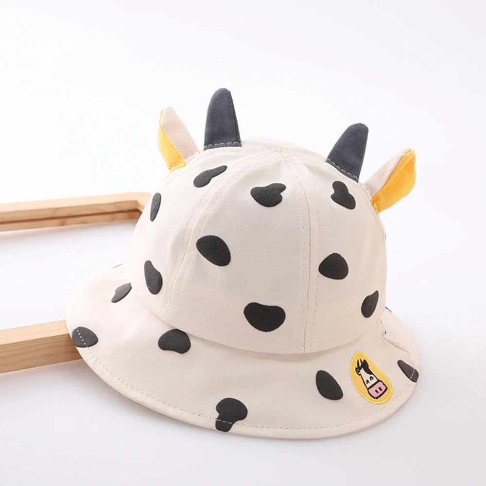 Adorable cow-patterned kids' bucket hat made of soft, breathable cotton for comfortable outdoor wear