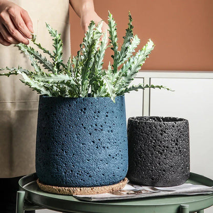 Nordic-style perforated cement bonsai planter in various sizes and colours, showcasing modern Scandinavian design for indoor gardening and home decor.