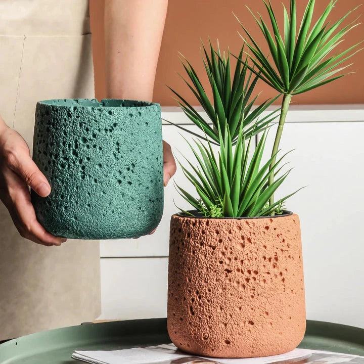Nordic-style perforated cement bonsai planter in various sizes and colours, showcasing modern Scandinavian design for indoor gardening and home decor.