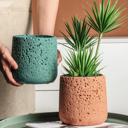 Nordic-style perforated cement bonsai planter in various sizes and colours, showcasing modern Scandinavian design for indoor gardening and home decor.